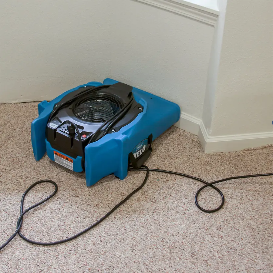 A high-volume air mover drying a floor in Antioch, IL
